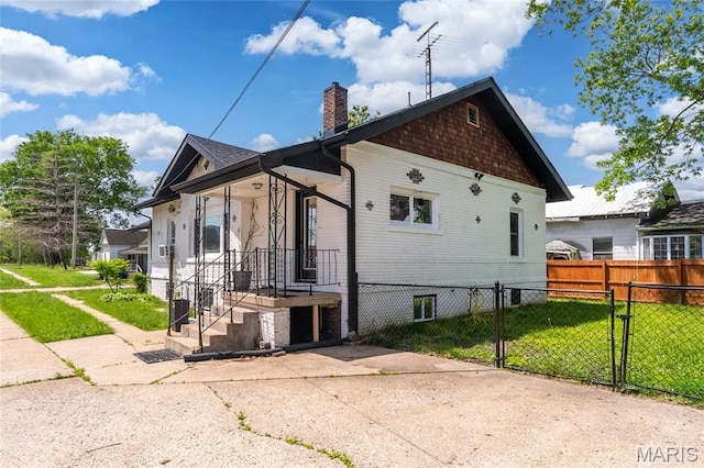 305 W Ray St, Christopher, IL 62822 - view of property exterior featuring a chimney