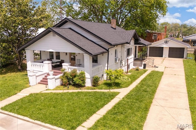 305 W Ray St, Christopher, IL 62822 - view of front facade with a porch, roof with shingles, a front yard, and a chimney