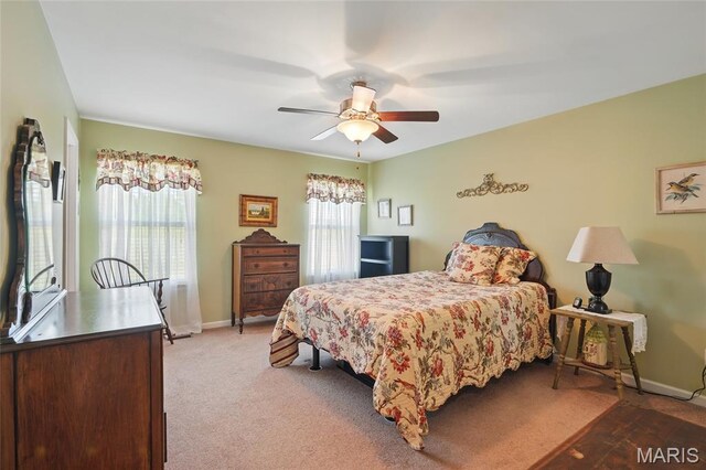 71 Hidden Mill Ct, Moscow Mills, MO 63362 - bedroom featuring baseboards, a ceiling fan, and light colored carpet