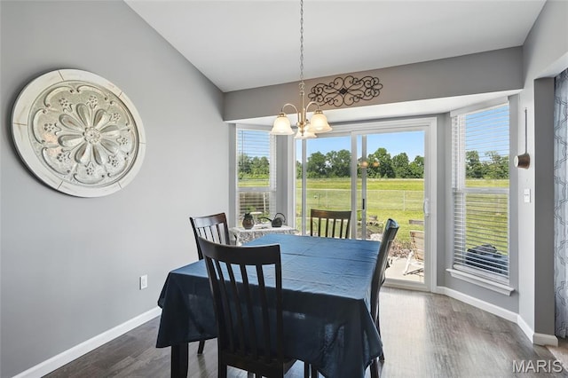 71 Hidden Mill Ct, Moscow Mills, MO 63362 - dining space with a chandelier, baseboards, and wood finished floors