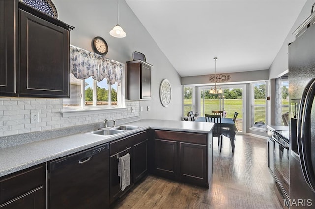 71 Hidden Mill Ct, Moscow Mills, MO 63362 - kitchen featuring black appliances, a sink, tasteful backsplash, dark wood finished floors, and light countertops