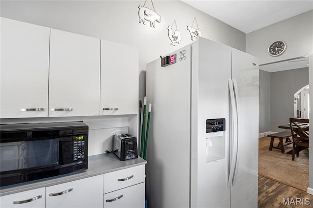 106 E Ofallon Dr, Caseyville, IL 62232 - kitchen featuring white fridge with ice dispenser, black microwave, white cabinets, and dark wood-style floors