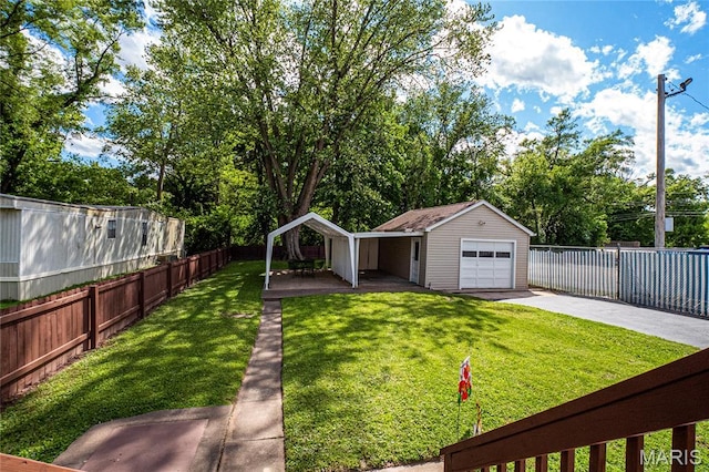 106 E Ofallon Dr, Caseyville, IL 62232 - view of yard with concrete driveway, a garage, and an outbuilding