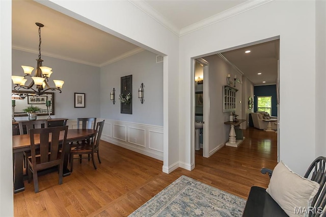 1804 Sterling Oaks Dr, Saint Peters, MO 63376 - dining area featuring a chandelier, light wood-type flooring, and crown molding