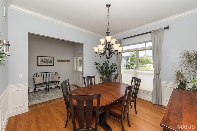 1804 Sterling Oaks Dr, Saint Peters, MO 63376 - dining room with a chandelier, crown molding, a wainscoted wall, and light wood-type flooring