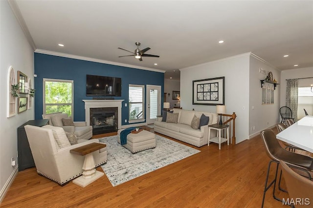 1804 Sterling Oaks Dr, Saint Peters, MO 63376 - living area featuring ceiling fan, healthy amount of natural light, wood finished floors, ornamental molding, and recessed lighting