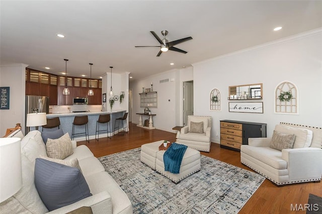 1804 Sterling Oaks Dr, Saint Peters, MO 63376 - living area with ceiling fan, ornamental molding, dark wood finished floors, and recessed lighting