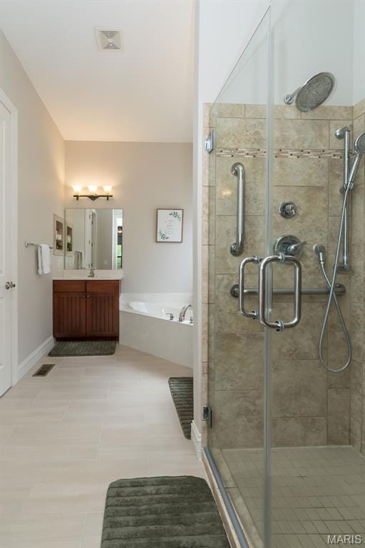 1804 Sterling Oaks Dr, Saint Peters, MO 63376 - bathroom featuring a stall shower, a garden tub, vanity, and tile patterned floors