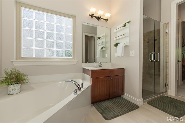 1804 Sterling Oaks Dr, Saint Peters, MO 63376 - bathroom featuring a shower stall, a bath, vanity, and baseboards