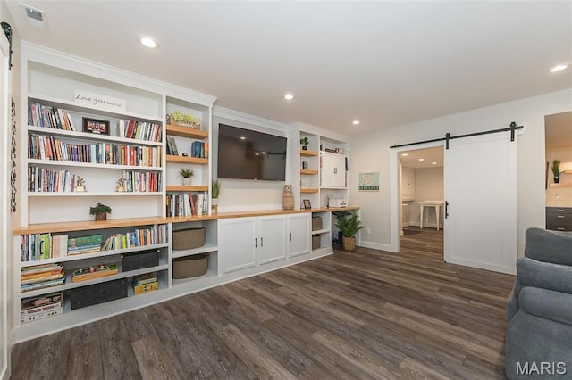 1804 Sterling Oaks Dr, Saint Peters, MO 63376 - living room with a barn door, dark wood-style floors, recessed lighting, and baseboards