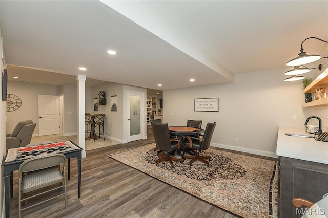1804 Sterling Oaks Dr, Saint Peters, MO 63376 - dining area with baseboards, wood finished floors, recessed lighting, and decorative columns