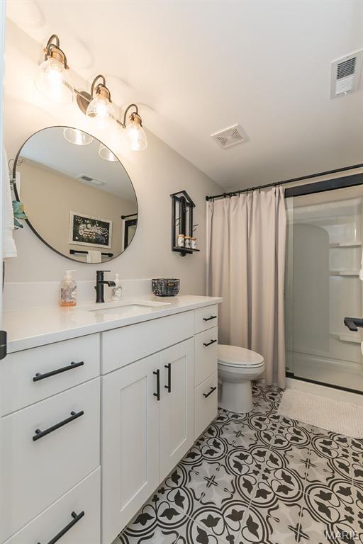 1804 Sterling Oaks Dr, Saint Peters, MO 63376 - bathroom featuring vanity, toilet, and curtained shower