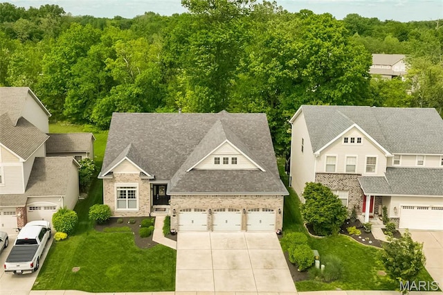 1804 Sterling Oaks Dr, Saint Peters, MO 63376 - view of front of house with concrete driveway, a front lawn, a garage, and a shingled roof