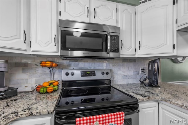729 Euclid Dr, Sikeston, MO 63801 - kitchen featuring appliances with stainless steel finishes and white cabinets