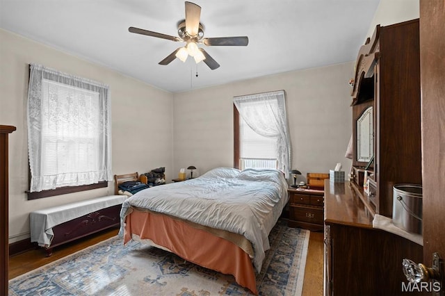 bedroom with wood finished floors and ceiling fan