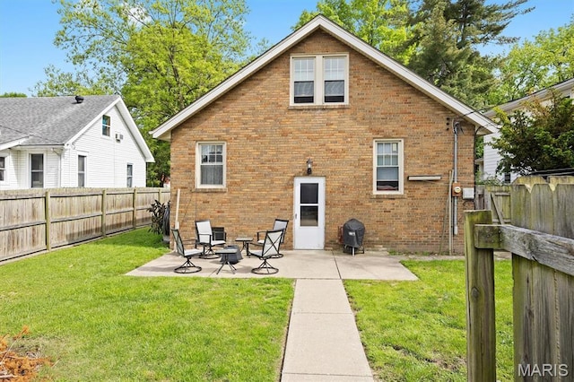 back of property with brick siding and a patio area