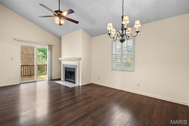unfurnished living room with a chandelier, dark wood-style flooring, vaulted ceiling, a textured ceiling, and ceiling fan