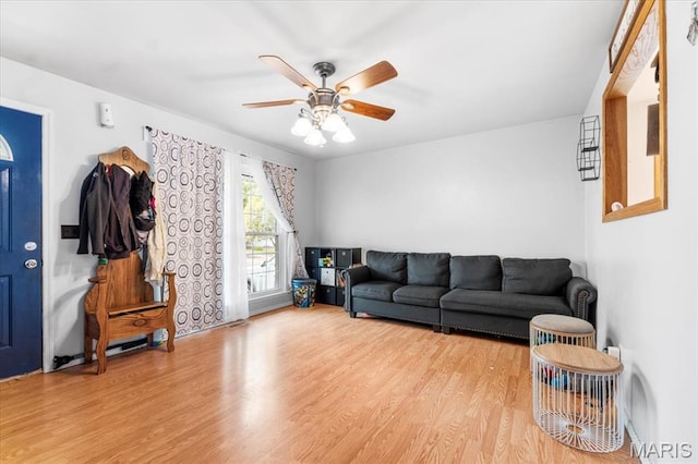 2270 Grants Pkwy, Florissant, MO 63031 - living area with wood finished floors and a ceiling fan