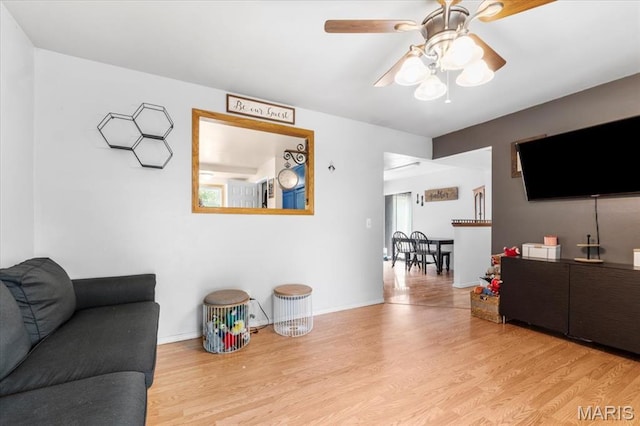 2270 Grants Pkwy, Florissant, MO 63031 - living room with wood finished floors, ceiling fan, and baseboards