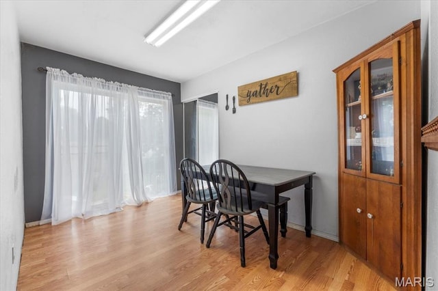 2270 Grants Pkwy, Florissant, MO 63031 - dining room featuring light wood-style flooring and baseboards