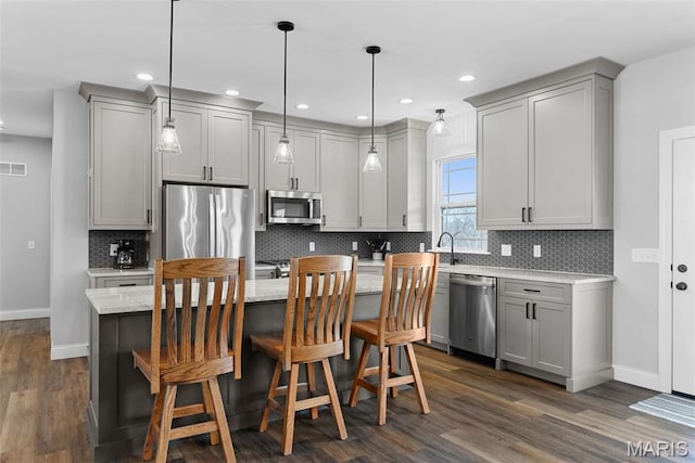 25 Gregory Michael Ln, Wright City, MO 63390 - kitchen with appliances with stainless steel finishes, gray cabinetry, dark wood-style floors, baseboards, and recessed lighting