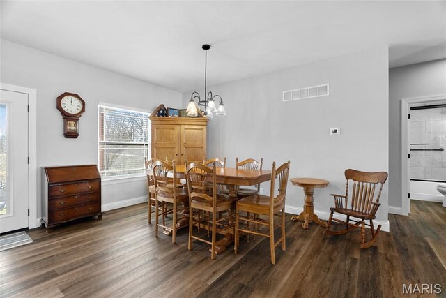 25 Gregory Michael Ln, Wright City, MO 63390 - dining area with wood finished floors, baseboards, and a chandelier