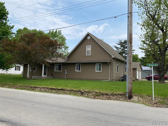 view of property exterior with a yard