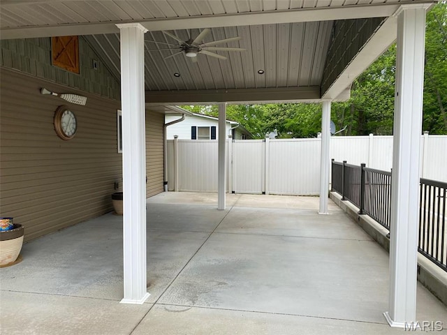 view of patio featuring a ceiling fan and fence