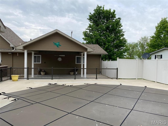 view of pool featuring fence and a patio