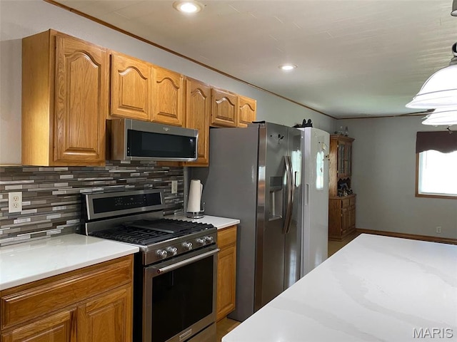 kitchen featuring stainless steel appliances, light countertops, tasteful backsplash, brown cabinets, and recessed lighting