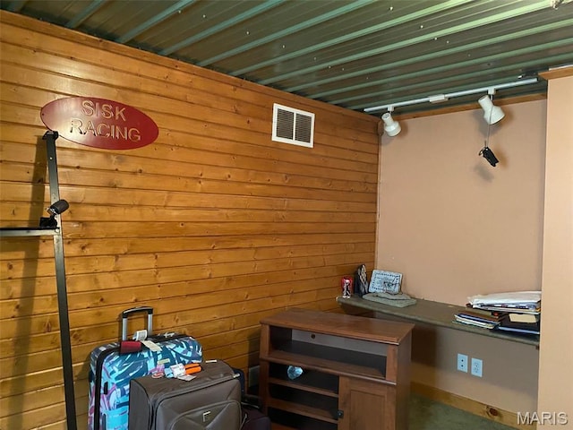 interior space featuring wooden walls