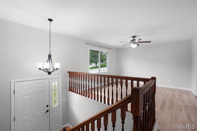 10 Brooker Ct, Saint Peters, MO 63376 - entryway featuring light wood-style flooring, ceiling fan, crown molding, baseboards, and a chandelier