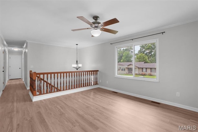 10 Brooker Ct, Saint Peters, MO 63376 - empty room featuring crown molding, light wood-type flooring, baseboards, and ceiling fan