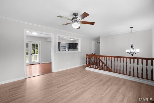 10 Brooker Ct, Saint Peters, MO 63376 - unfurnished room with crown molding, light wood finished floors, a ceiling fan, a chandelier, and baseboards