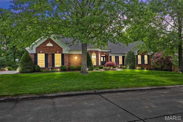 26 Windcastle Dr, Saint Charles, MO 63304 - view of front of property featuring brick siding and a front yard