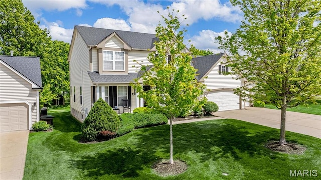 view of front of home featuring driveway, a front yard, and a shingled roof