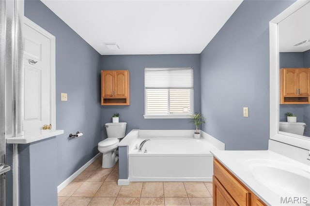 bathroom with toilet, a garden tub, tile patterned flooring, and vanity