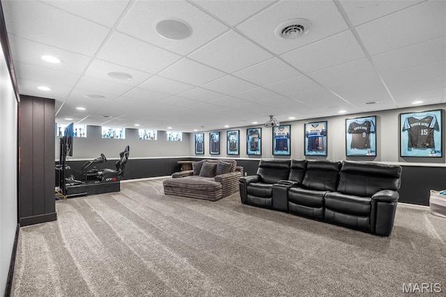 carpeted cinema room featuring a drop ceiling, recessed lighting, and baseboards