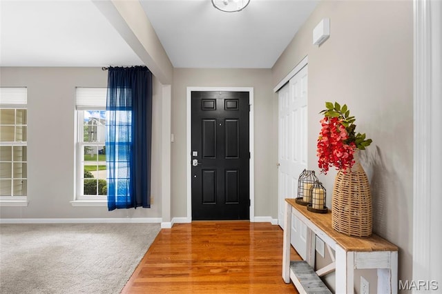 12 Lambeth Ln Unit 11B, Dardenne Prairie, MO 63368 - foyer entrance featuring baseboards and light wood-style floors