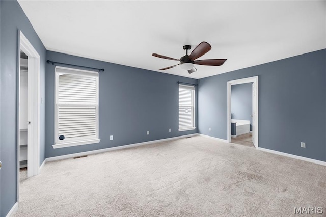12 Lambeth Ln Unit 11B, Dardenne Prairie, MO 63368 - unfurnished bedroom featuring carpet flooring, baseboards, ensuite bath, and ceiling fan
