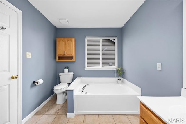 12 Lambeth Ln Unit 11B, Dardenne Prairie, MO 63368 - bathroom featuring toilet, a garden tub, tile patterned floors, vanity, and baseboards