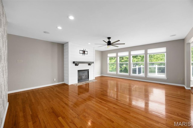 12 Lambeth Ln Unit 11B, Dardenne Prairie, MO 63368 - unfurnished living room with a ceiling fan, baseboards, a large fireplace, and recessed lighting