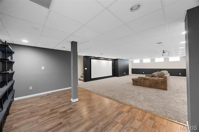 12 Lambeth Ln Unit 11B, Dardenne Prairie, MO 63368 - living area featuring baseboards, wood finished floors, and a drop ceiling