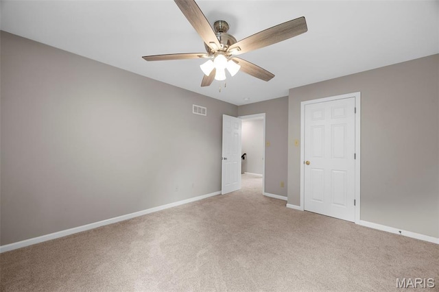 12 Lambeth Ln Unit 11B, Dardenne Prairie, MO 63368 - unfurnished bedroom with light carpet, baseboards, and ceiling fan