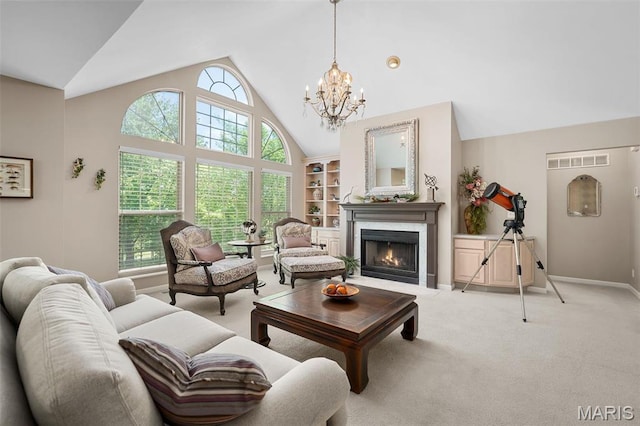 1189 Turnberry Dr, Innsbrook, MO 63390 - living area featuring plenty of natural light, a fireplace with flush hearth, a chandelier, light carpet, and high vaulted ceiling
