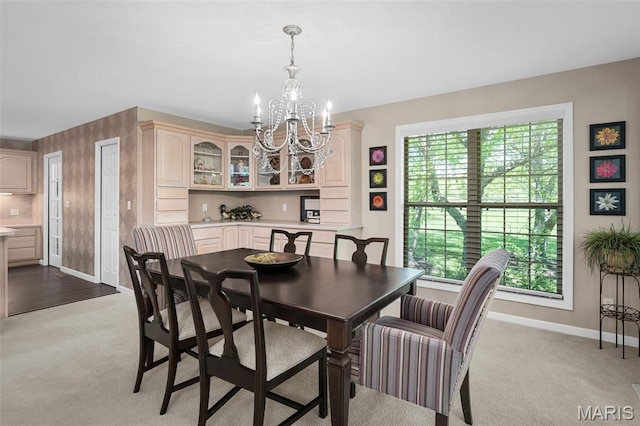 1189 Turnberry Dr, Innsbrook, MO 63390 - dining room featuring baseboards, a chandelier, light carpet, and plenty of natural light