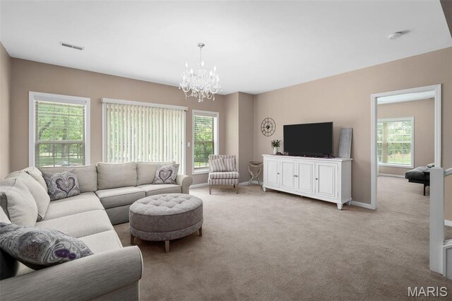 1189 Turnberry Dr, Innsbrook, MO 63390 - carpeted living room featuring plenty of natural light, a chandelier, and baseboards