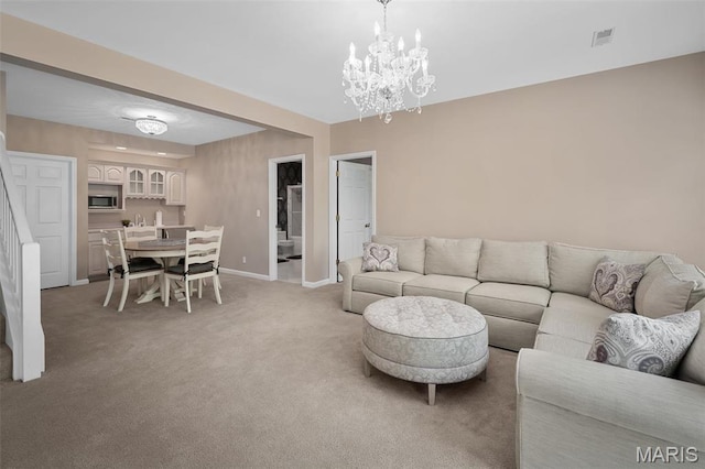 1189 Turnberry Dr, Innsbrook, MO 63390 - living room with light colored carpet, baseboards, a chandelier, and stairway