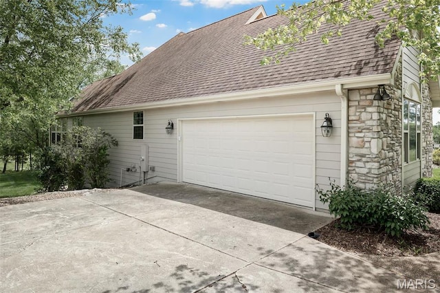1189 Turnberry Dr, Innsbrook, MO 63390 - view of side of home featuring stone siding, driveway, and a shingled roof