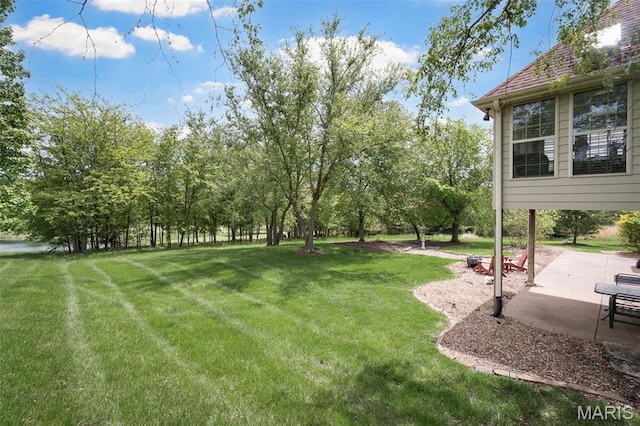 1189 Turnberry Dr, Innsbrook, MO 63390 - view of green lawn featuring a patio